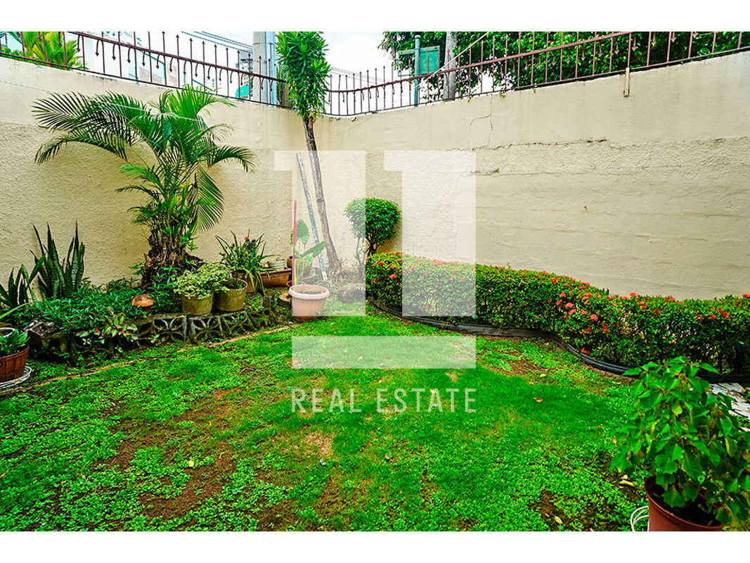 Small bathroom with vessel sink and glass wall shelf Altos del Golf house