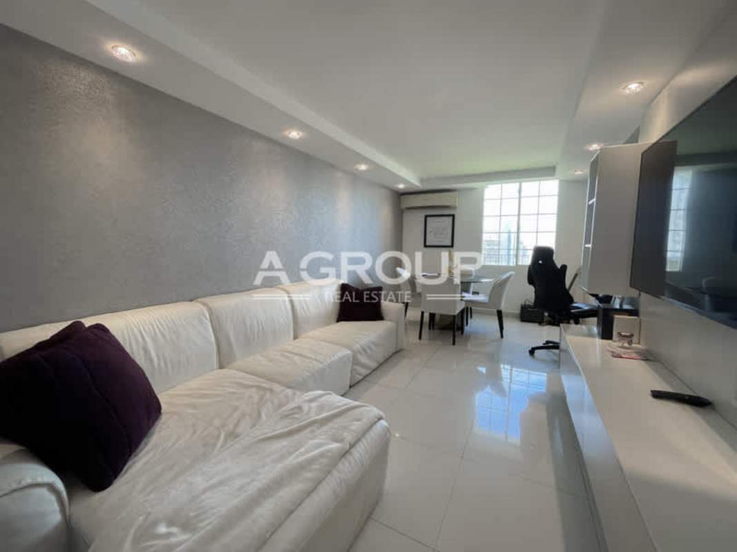 Large open living and dining area with floor-to-ceiling windows and skyline views, PH Tamanaco Punta Paitilla