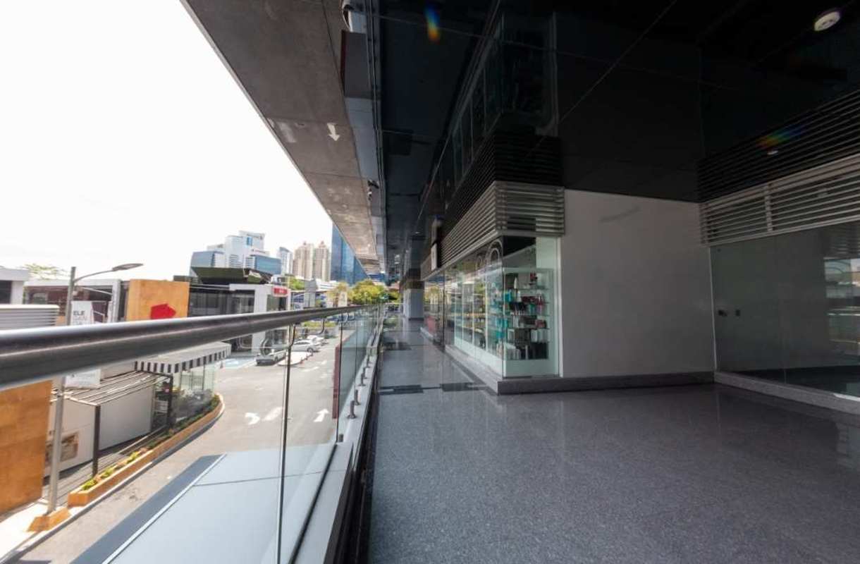 Bright corridor in commercial building with glass windows and porcelain floor Panama City