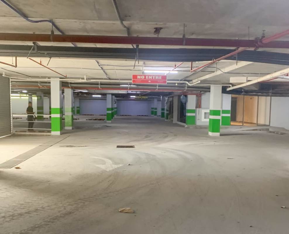 Secure ventilated parking garage with signage and concrete floors Sunset Strip Mall Panama