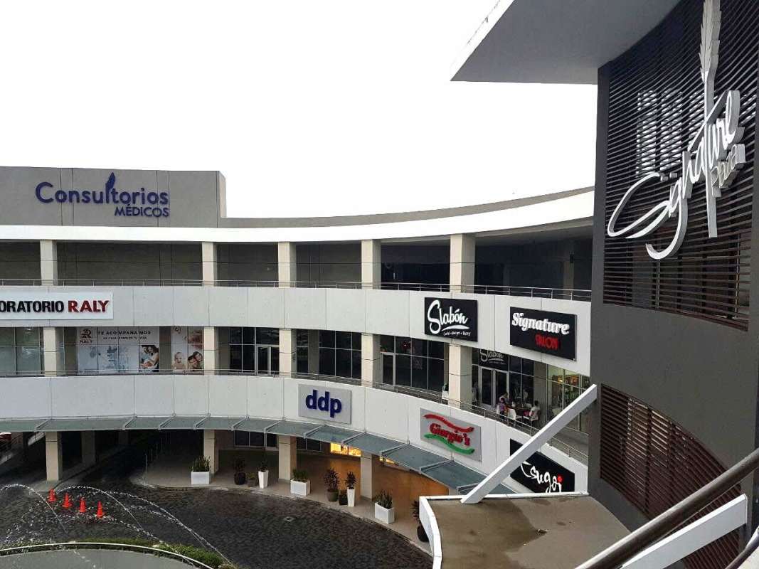 Modern commercial shopping plaza with fountain retail shops office spaces in Brisas del Golf Panama
