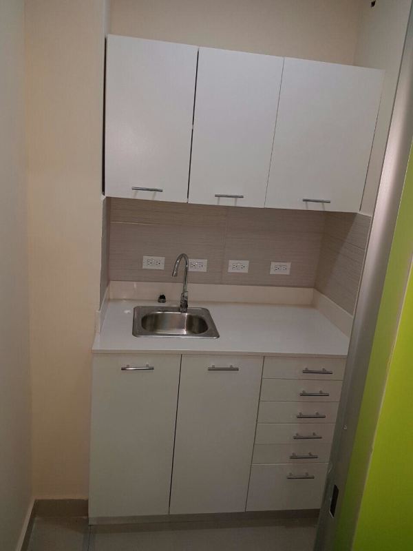 Small kitchenette with sink cabinetry and outlets commercial plaza Brisas del Golf Panama