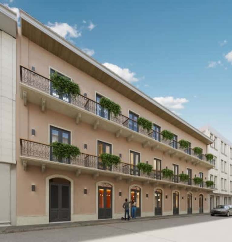 Three-story colonial building with balconies and greenery Casco Antiguo Panama