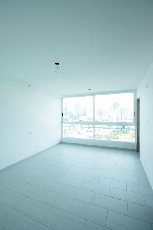 Modern living and dining room with large windows city view PH The Towers San Francisco Panama