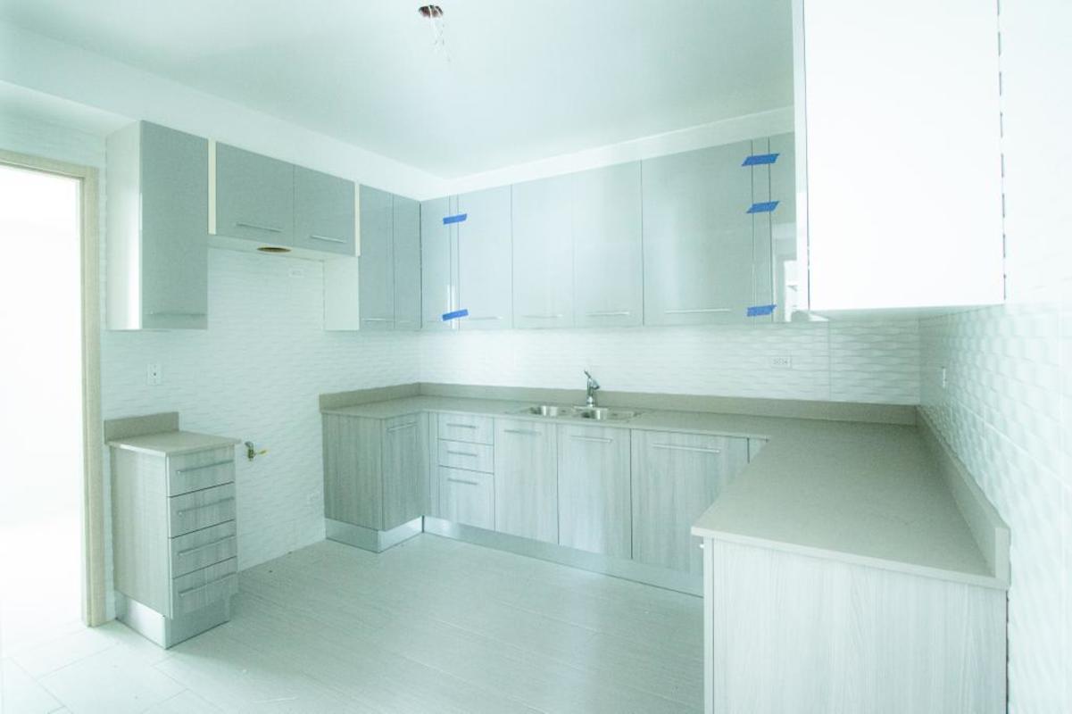 Minimalist kitchen design with light cabinetry quartz countertops PH The Towers Panama City