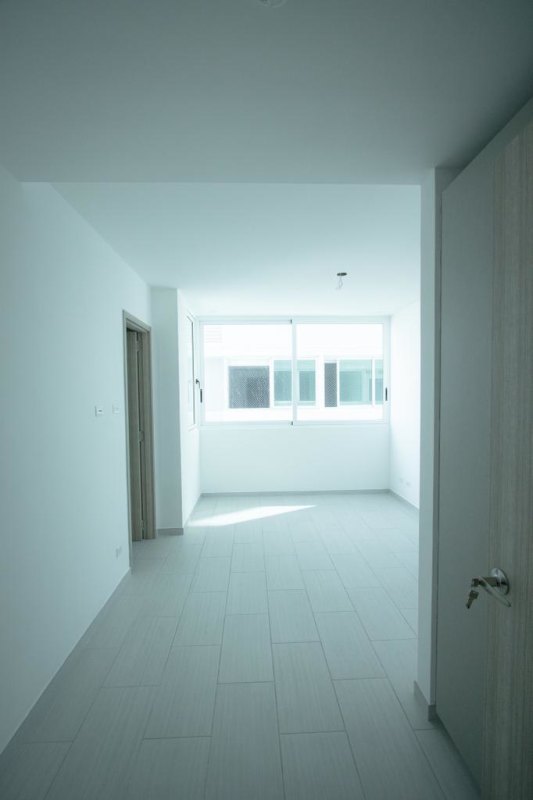 Modern bright bedroom with window and tile floors PH The Towers San Francisco Panama