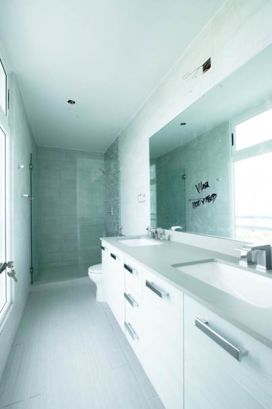 Modern bathroom with double sink vanity large mirror glass shower PH The Towers Panama