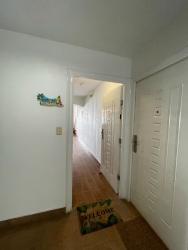 Modern kitchen with granite countertop and appliances at Playa Farallón condo