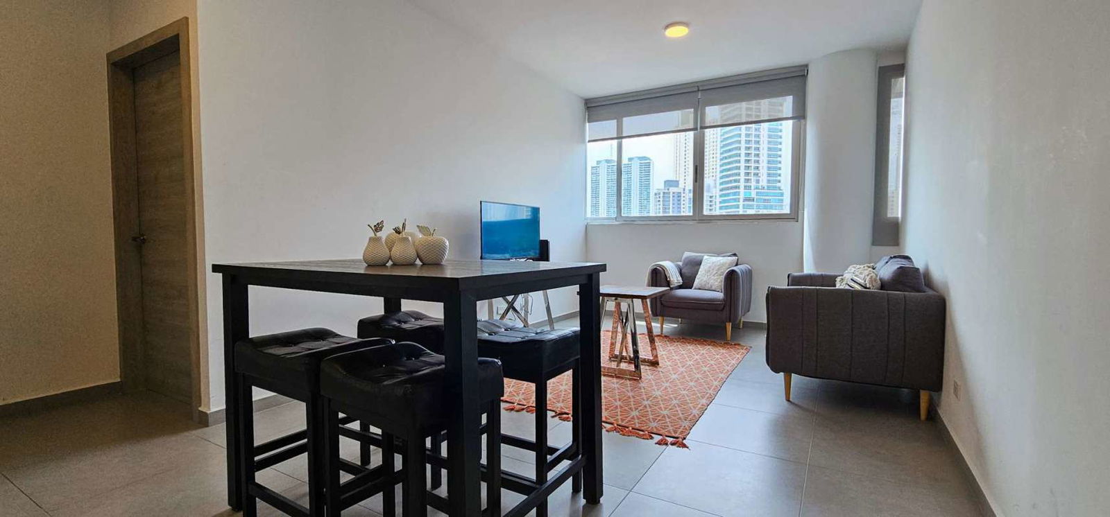 Kitchen with granite countertops, stainless appliances, stacked washer dryer at Signature Point La Cresta Panama City