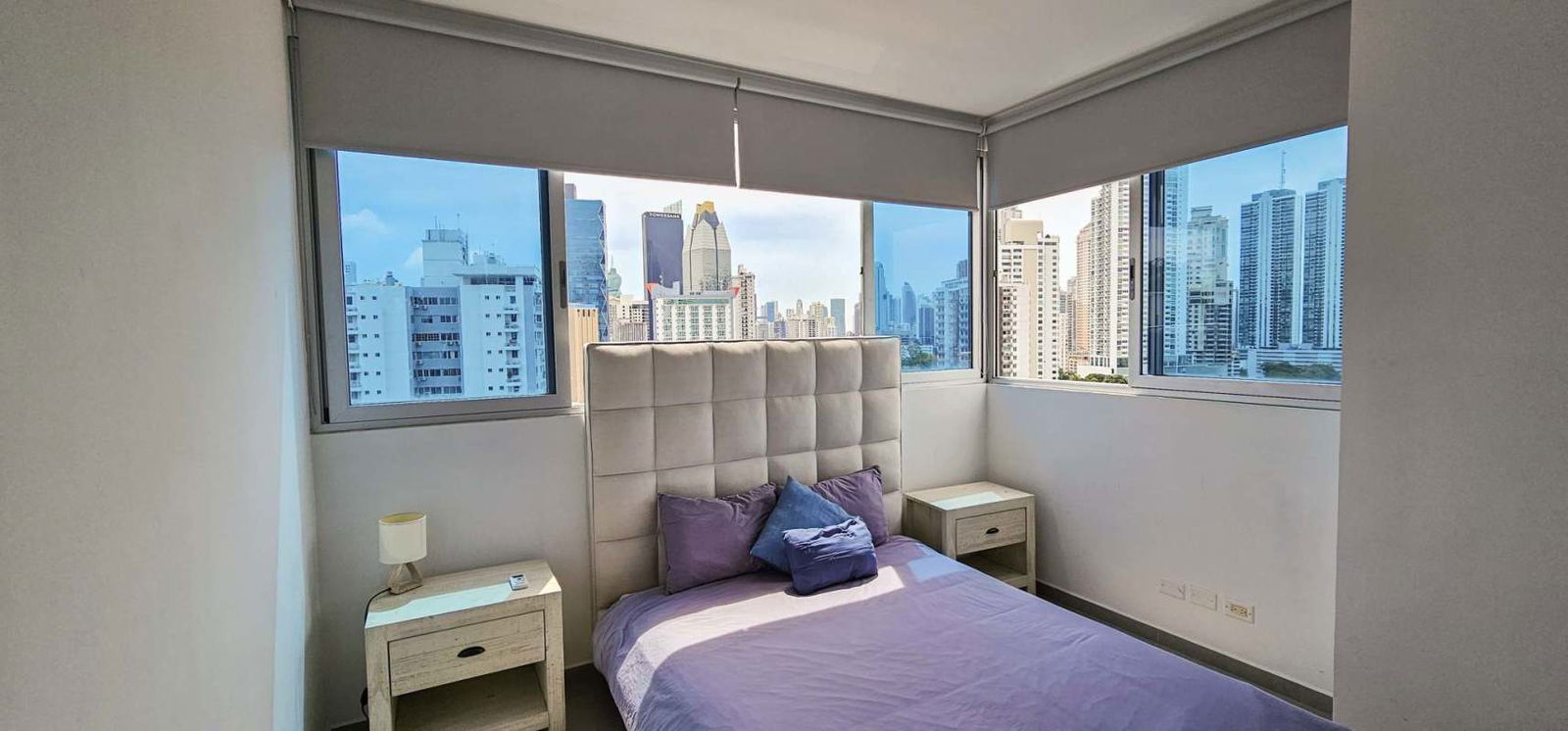 Minimalist bathroom walk-in glass shower natural light at Signature Point La Cresta Panama City