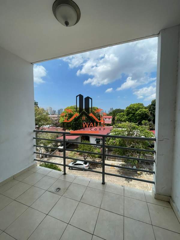 Functional kitchen with dark wood cabinets and stainless appliances at PH Verde Azul El Ingenio Panama City