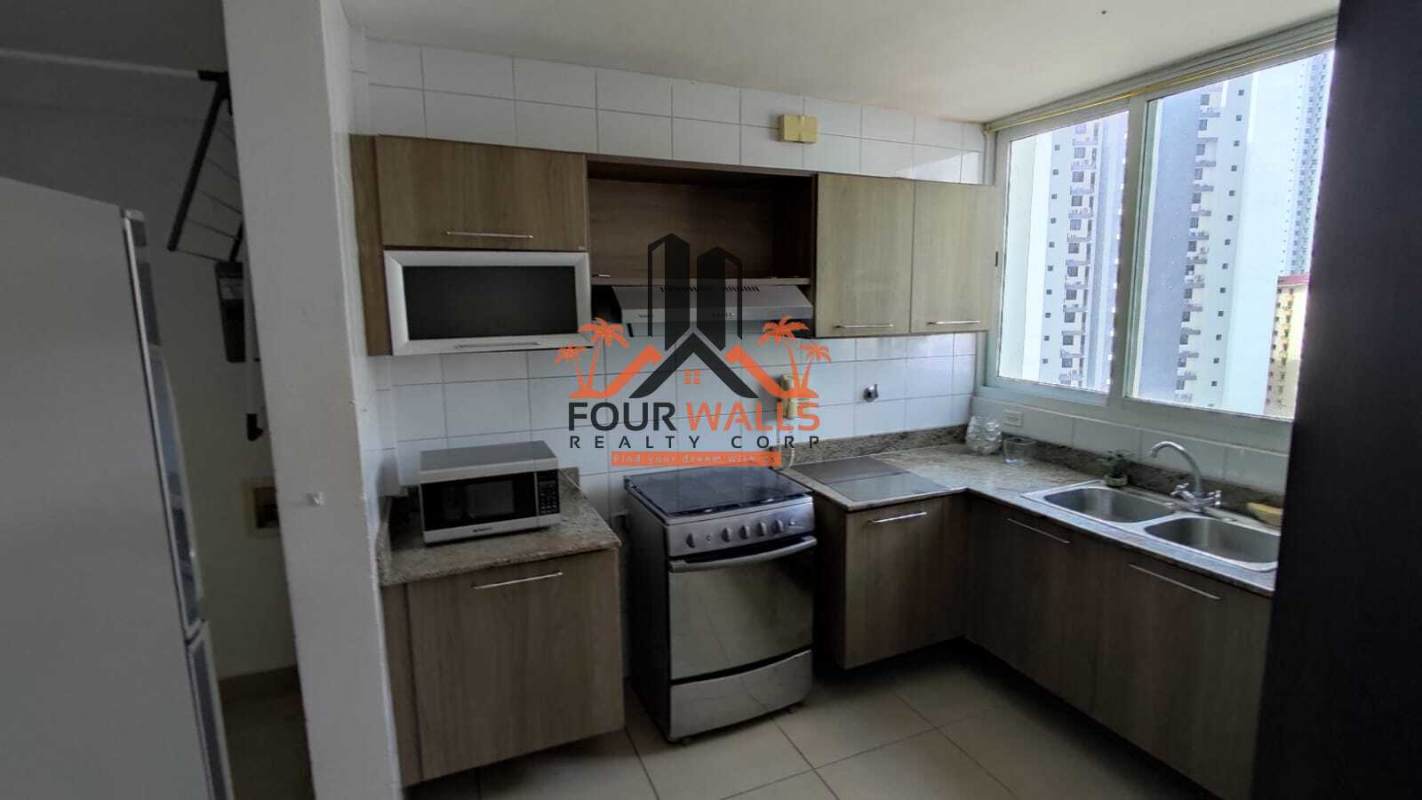 Bright living dining area with access to balcony in PH Kings Park Condado del Rey Panama City