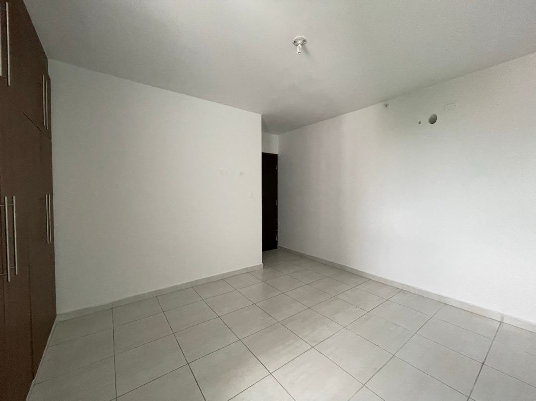 Minimalist bedroom with built-in wardrobe in PH Trinity Tower Panama City