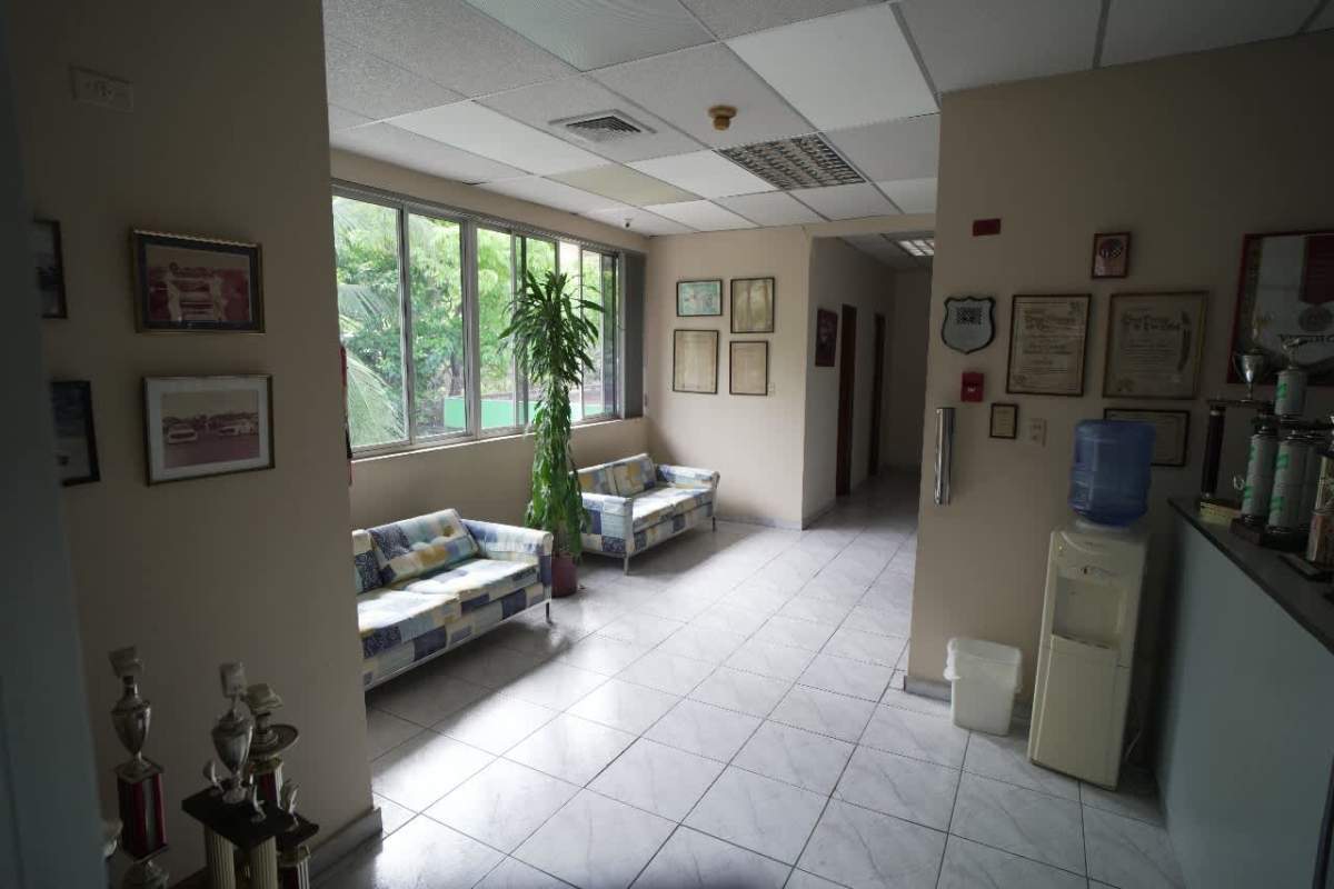 Reception area with large windows and trophy display commercial building Betania Panama