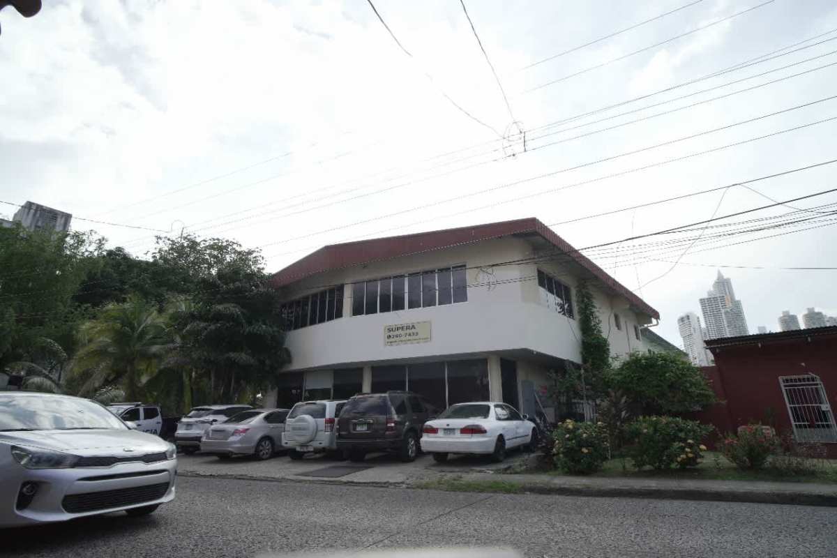 Spacious dual-level interior office with large windows and tiled floors in commercial building Panama