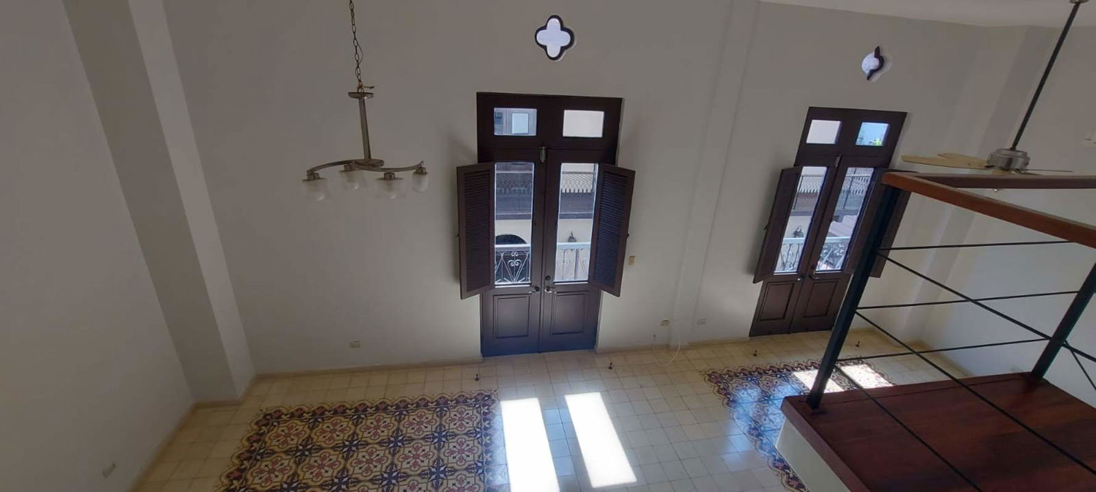 Colonial-style building with balconies and green shutters in historic Casco Viejo Panama