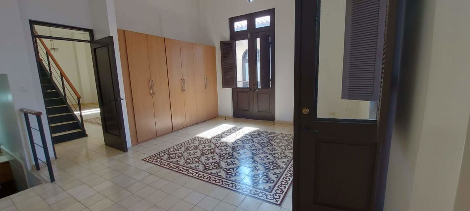 Colonial balcony with terracotta tiles overlooking cobblestone street Casa Ruigar Panama