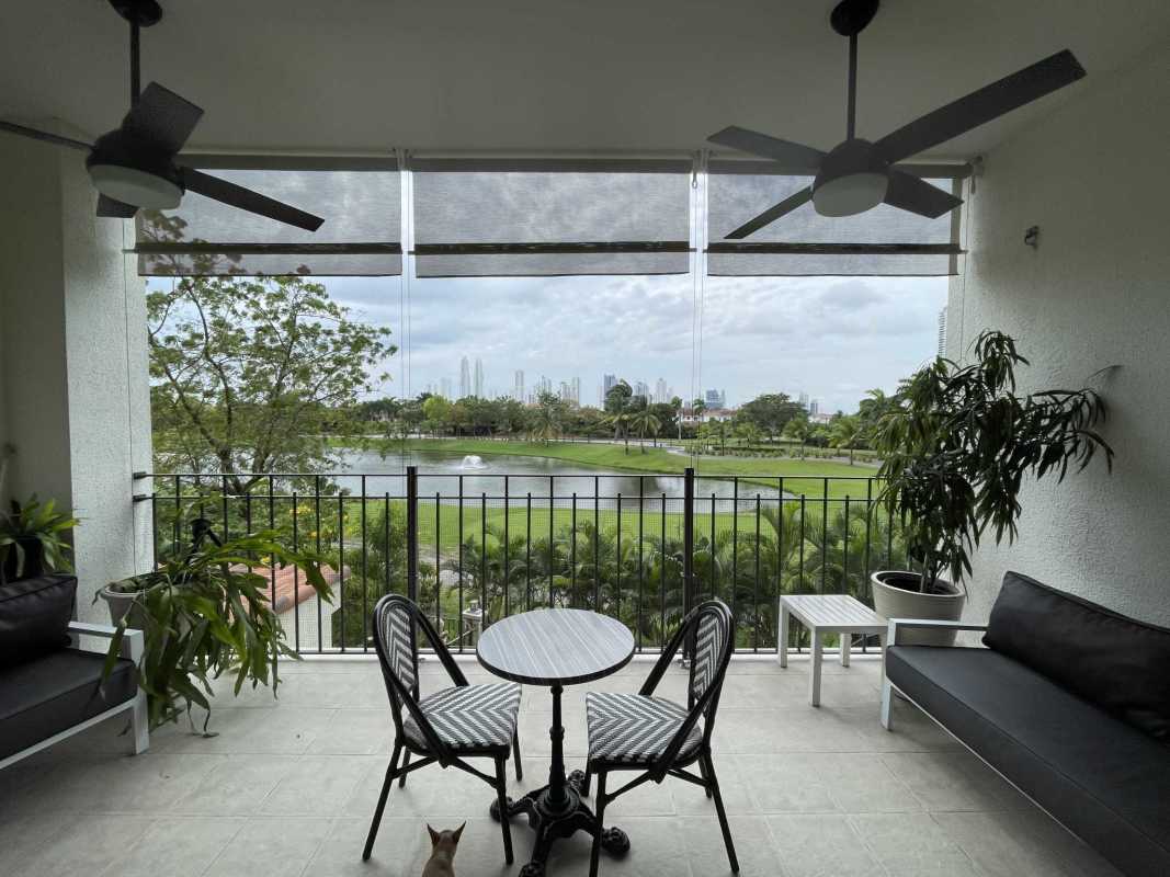 Modern half bathroom with botanical wallpaper, round mirror and lighting in luxury apartment Santa María Panama