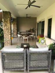 Spacious living and dining room open layout with large windows Punta Barco Village Panama