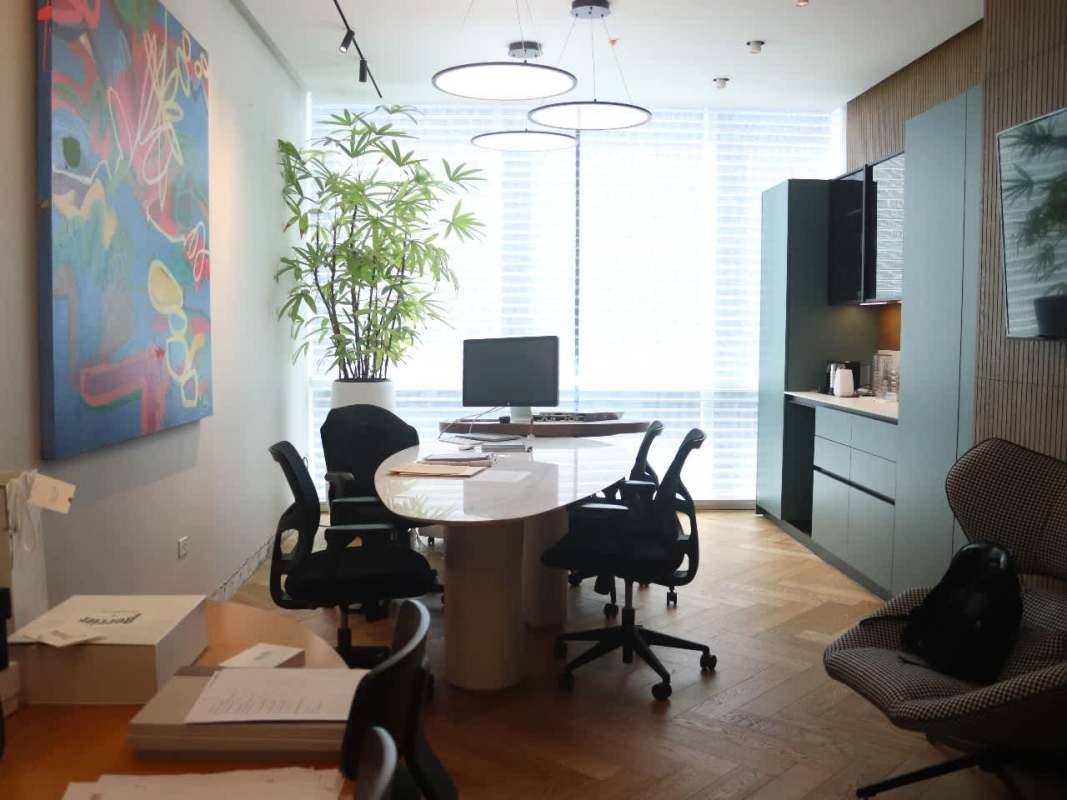 Bright modern meeting space with glass partitions at PH Torre Arifa Santa Maria