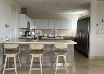 Luxury kitchen with island seating, stainless appliances, bright open space Buenaventura penthouse