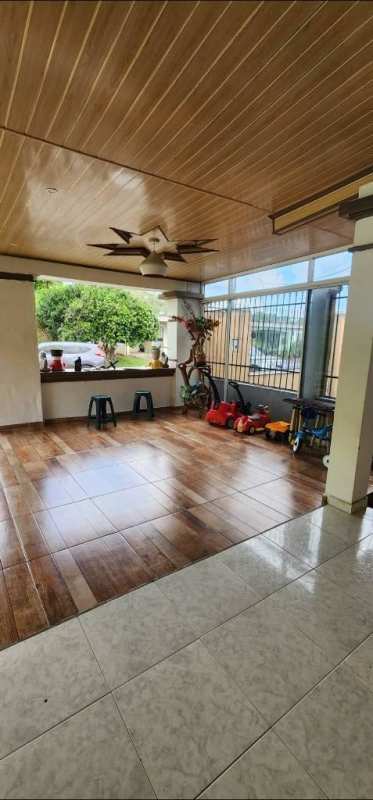 Hallway with tile floor, metal door, white walls, Panama Cerro Viento house