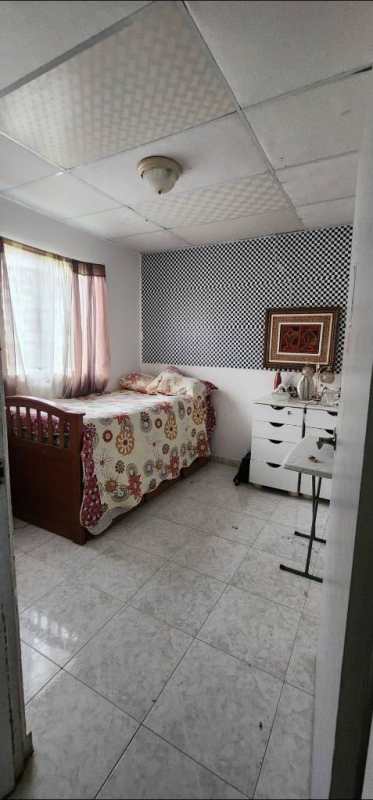 Bright nursery with animal mural, crib, glass door, tiled flooring in San Antonio Cerro Viento Panama house