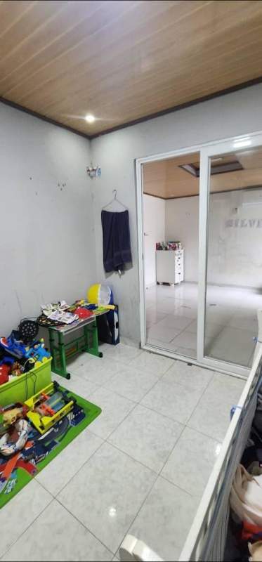 White crib, toys, wood ceiling nursery playground San Antonio Panama house