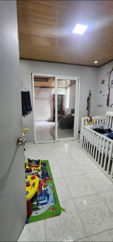 Playroom with toys, sliding glass doors, tiled floor, wood ceiling Panama