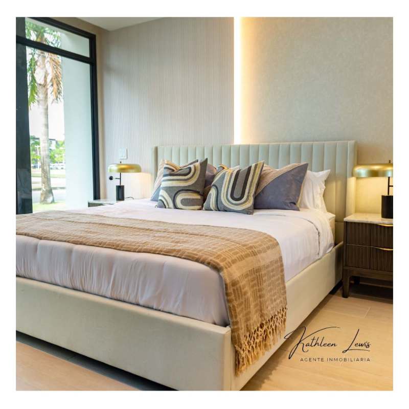 Bedroom with floor-to-ceiling windows and neutral decor at PH Nogal Costa del Este Panama