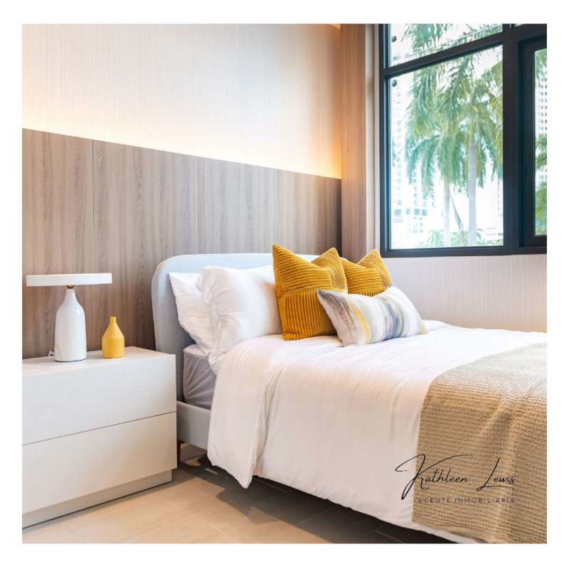 Infinity pool and sky terrace with lounge chairs overlooking skyline at PH Nogal Costa del Este Panama