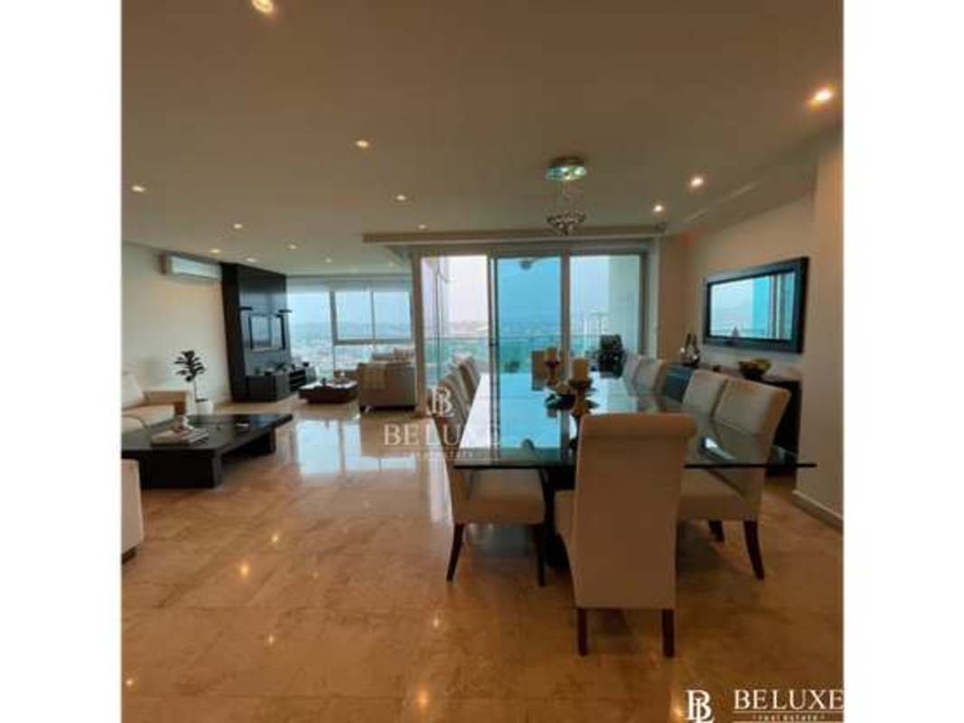 Spacious living room with marble floor, large windows and panoramic city views at PH Titanium Costa del Este Panama