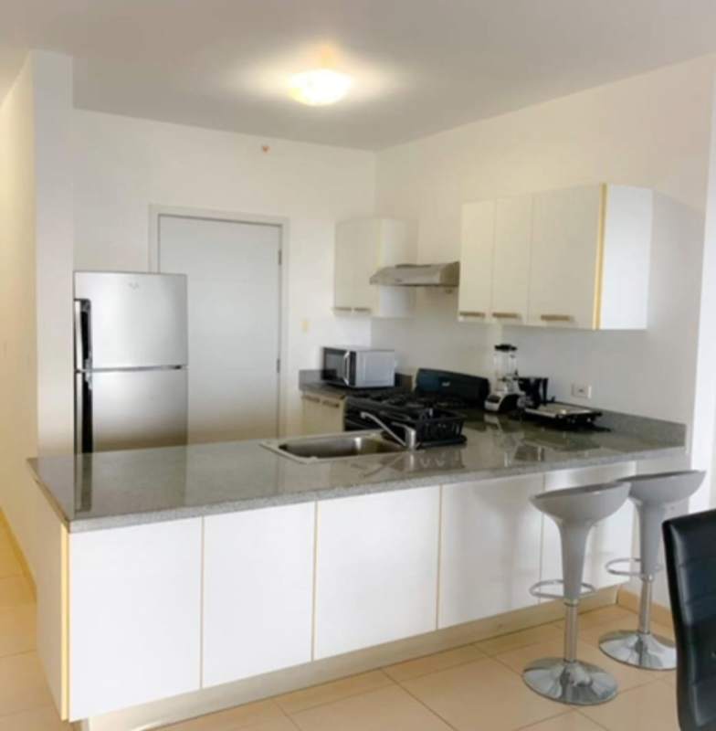 Granite kitchen with appliances and dining space at PH Water on the Bay Panama