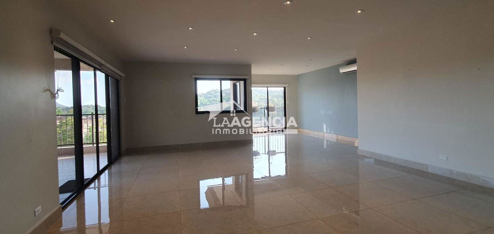 Spacious remodeled kitchen with island, granite countertop, and stainless appliances Embassy Club Panama