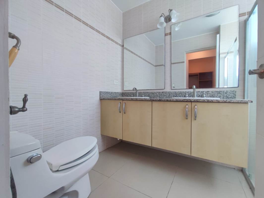 Modern bathroom with granite vanity and glass shower enclosure Costa del Este Panama