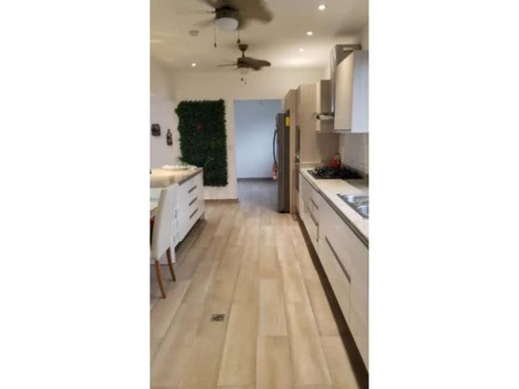 Modern kitchen with breakfast nook and porcelain floors in PH Provenza Diablo Heights Panama