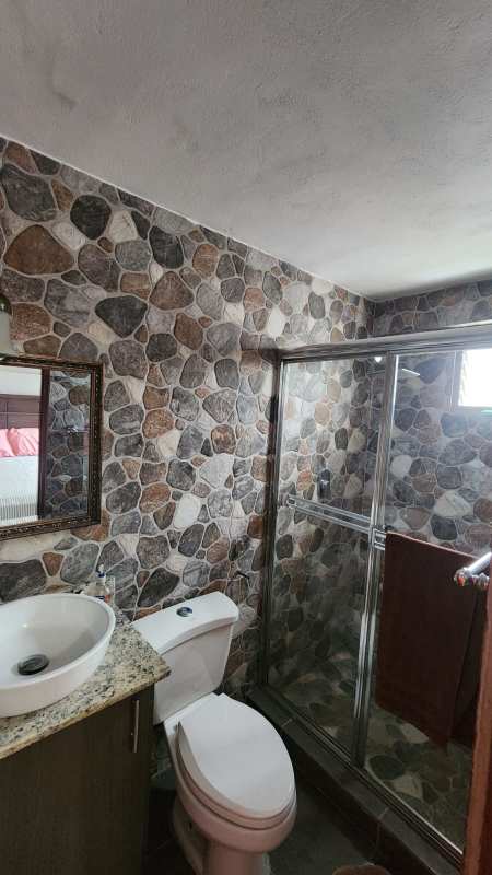 Second bedroom with ceramic floors, closet, window with neighborhood view Condominio El Jilguero Panama