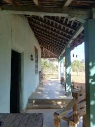 Small rustic countryside home with clay tile roof and open garden Los Santos Province Panama