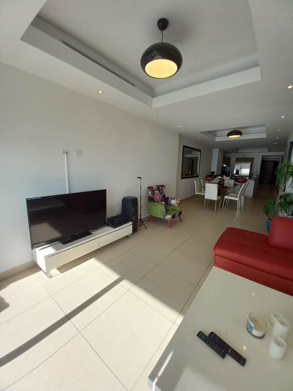 Kitchen with granite countertops, modern appliances in oceanfront apartment PH Rivage Panama