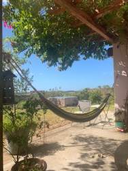 River with waterfall flowing through natural forest landscape on large farmland property in Coclé Panama