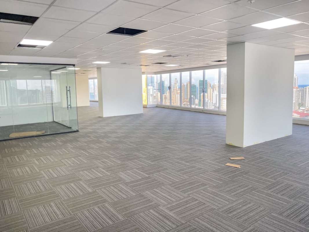 Large open-plan modern commercial office in Evolution Tower with skyline view