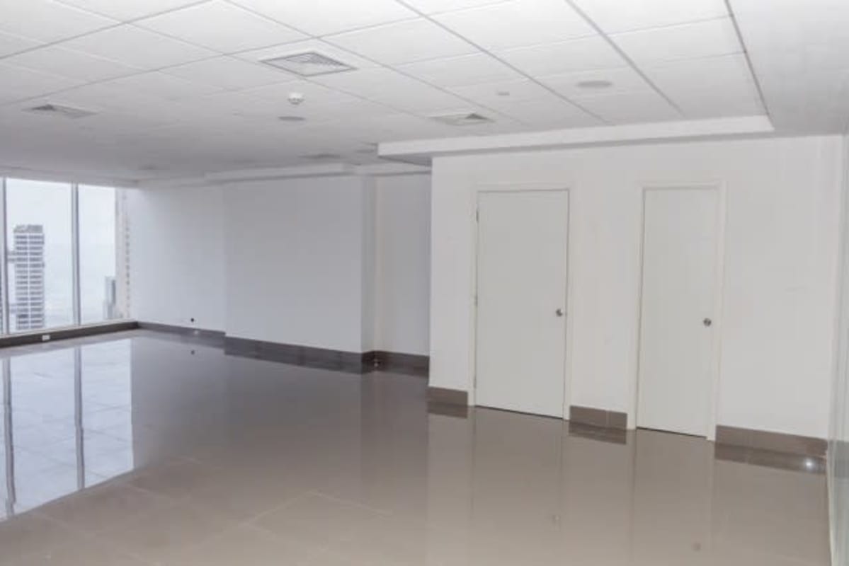 Modern corporate lobby with marble floors and elevators in Evolution Tower Panama City