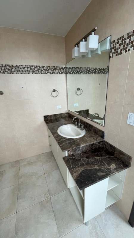 Bright open living dining room with large windows at PH Riverside Costa del Este Panama