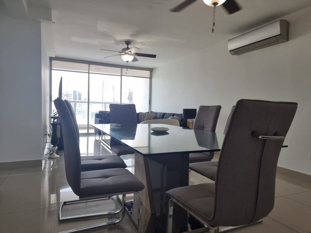 Contemporary living space with skyline views, large windows, neutral furniture PH Obarrio Panama