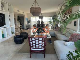 Modern coastal dining space with floor-to-ceiling windows and ocean views PH Velamar Penthouse Buenaventura Panama