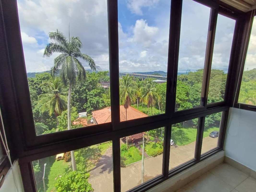 Contemporary bathroom design with glass shower and mosaic accents at Amador Heights Panama