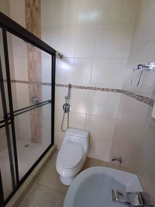 Large bedroom with built-in wardrobe and window in Amador Heights near Albrook Panama