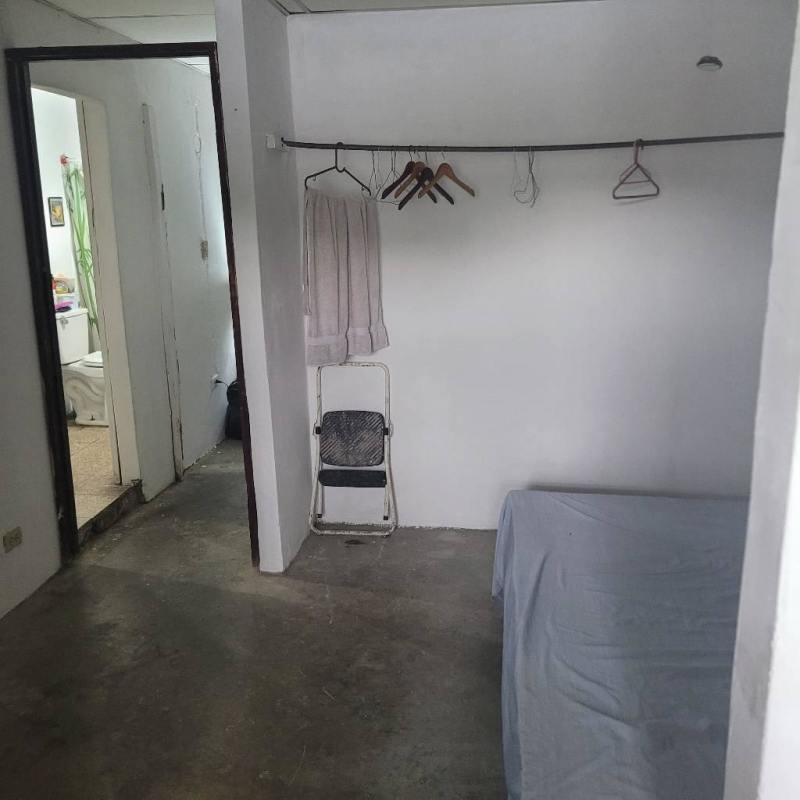 Bedroom with concrete floor, step ladder, access to bathroom Villa Guadalupe Panama City