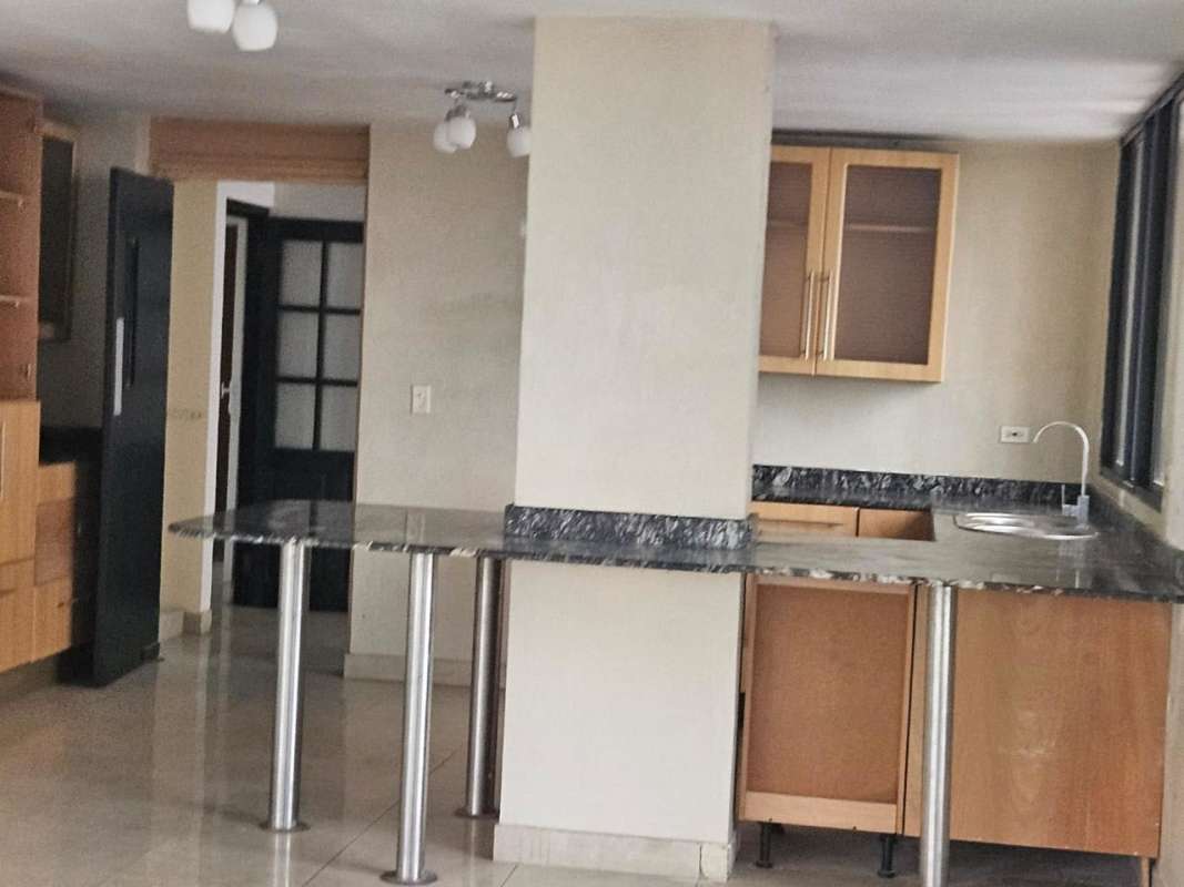 Indoor parking garage with columns and handicap markings in Bella Vista Panama