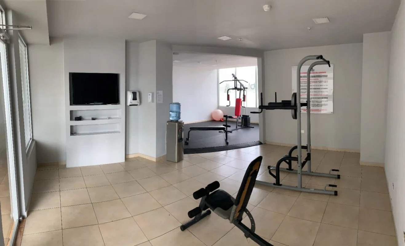 Living room with ceiling fans and natural light in PH Sky Blue Panama City